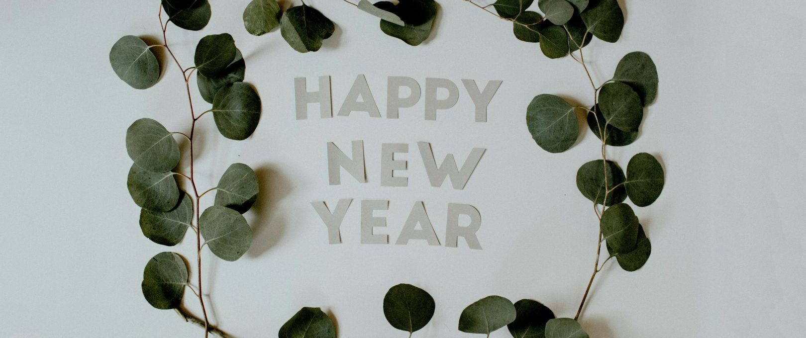 happy new year greeting card with eucalyptus leaves at The  Franklin at Samuels Ave