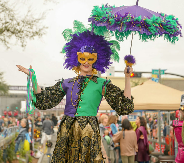 a woman in a costume holding an umbrella at The  Franklin at Samuels Ave